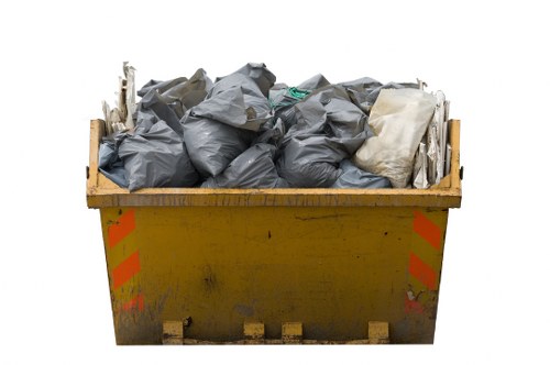 Enclosed skip on a residential property in Hackbridge